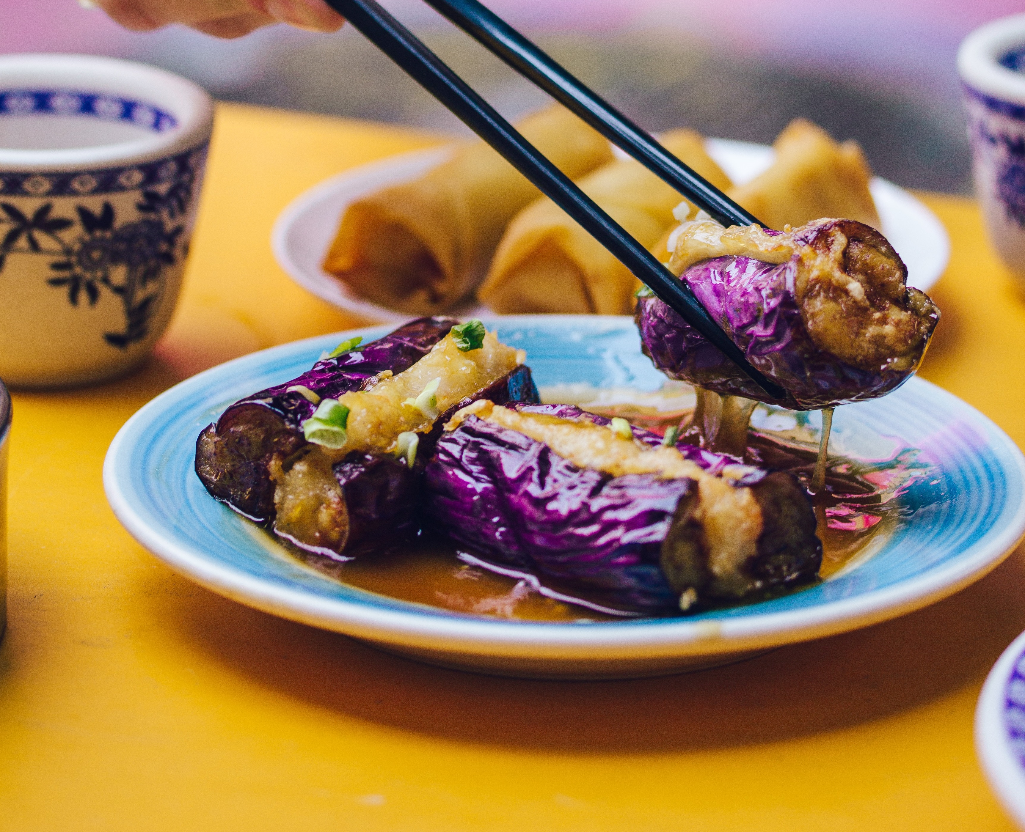 Eggplant held up with chopsticks