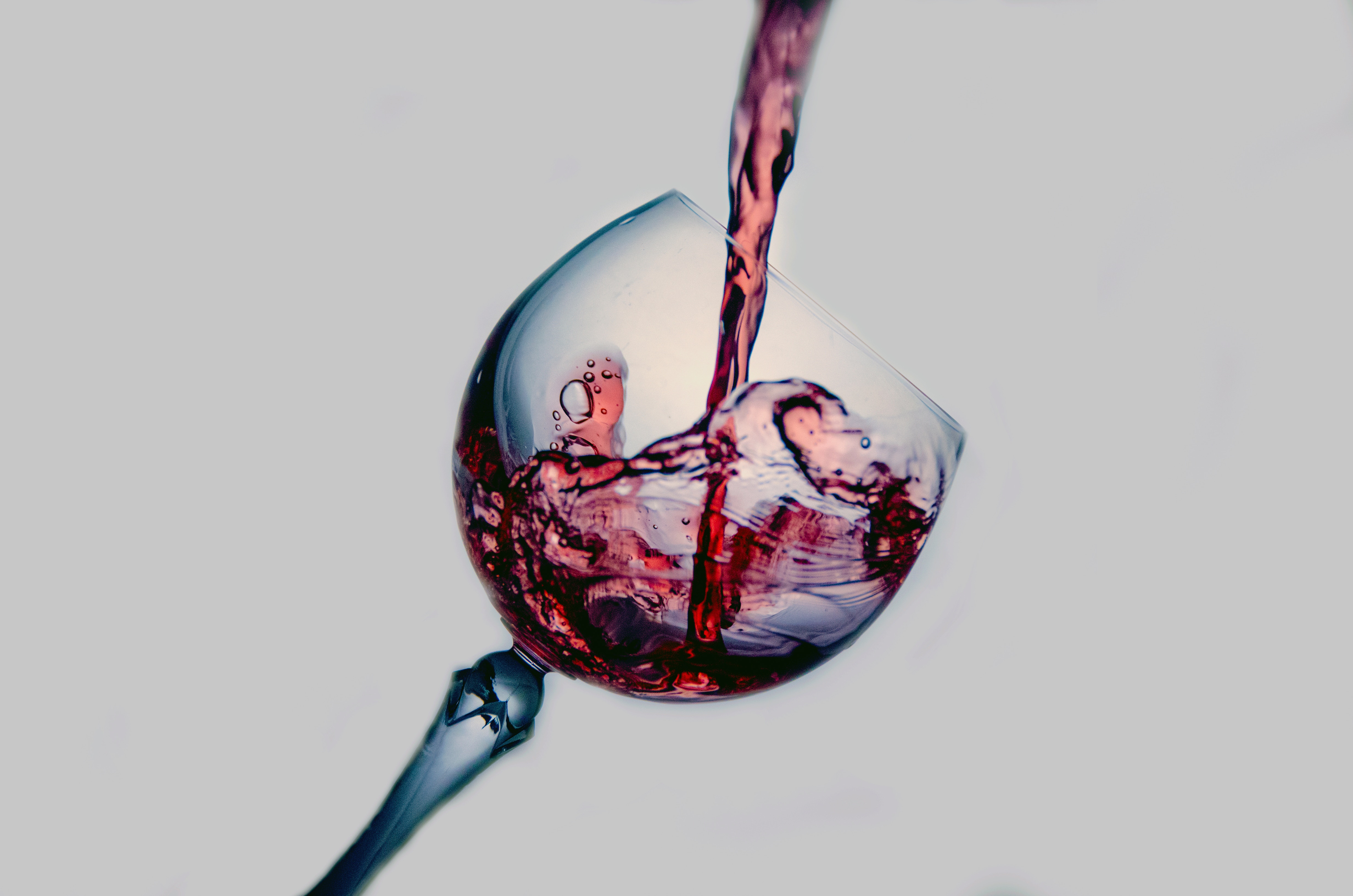 Wine pouring into clear glass